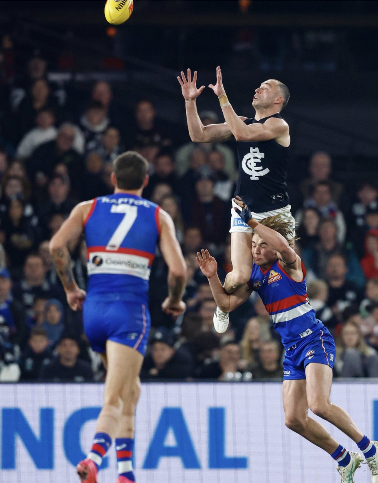 A Carlton player rises above a pack to take a contested mark — the Blues took 117 marks to Melbourne's 61 in the wildcard final