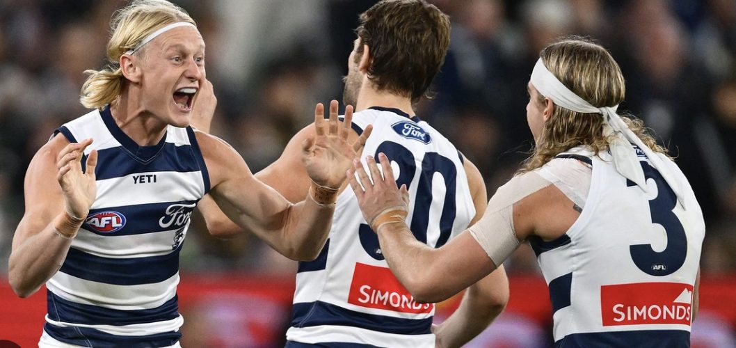 Geelong players celebrate a goal — the Cats are one of the sides jostling for position as the wildcard era begins