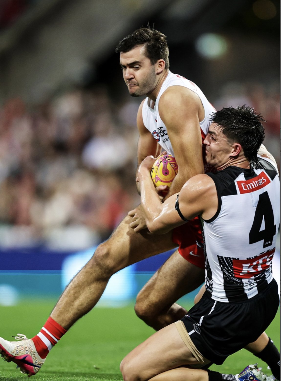 A Sydney Swans player braces in a tackle — the Swans host Fremantle at the SCG in Friday night's preliminary final